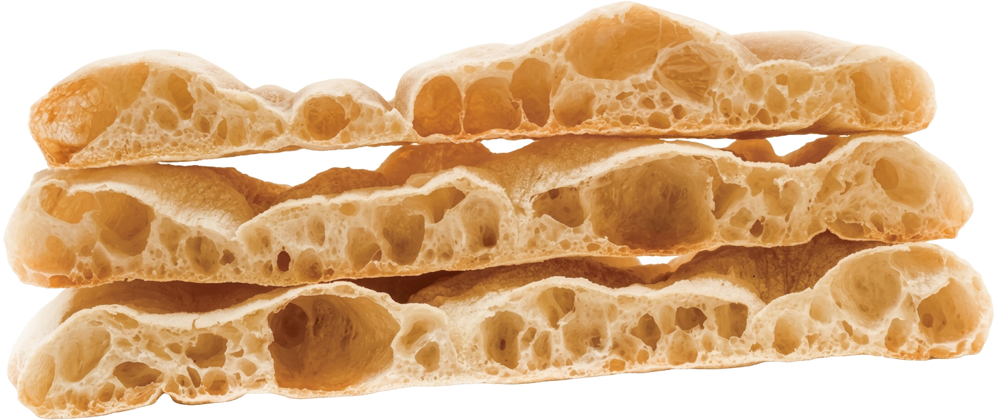 Three stacked slices of Pinsa Romana showing their open, airy crumb